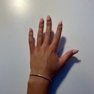 Plated gold adjustable bracelet with a flat diamond piece